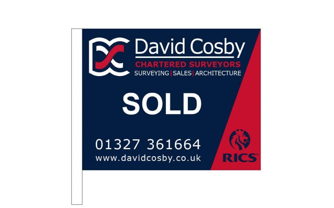 Daventry and Towcester Estate Agents. David Cosby Blue and Red 'SOLD' Sign