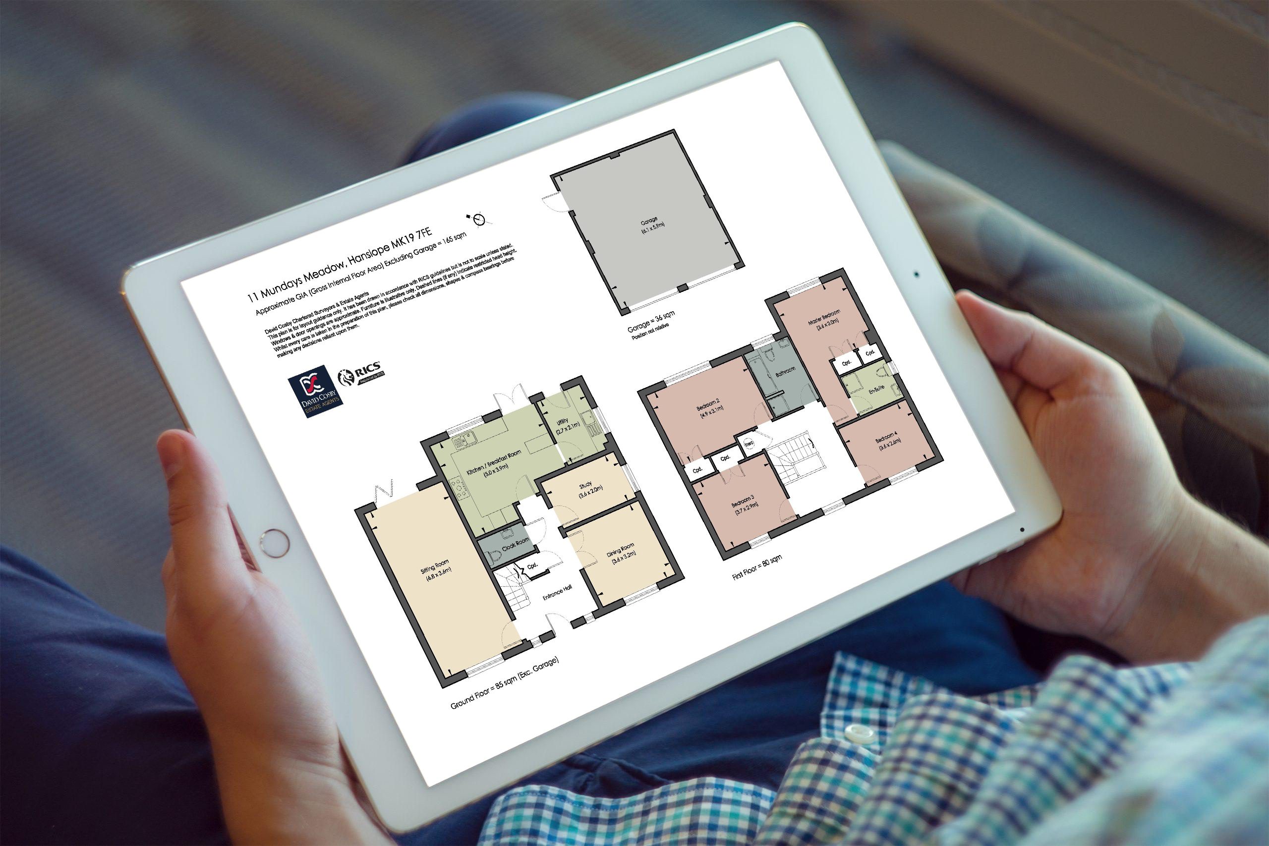 Client sitting down viewing David Cosby Estate Agent's floor plans on an Ipad.